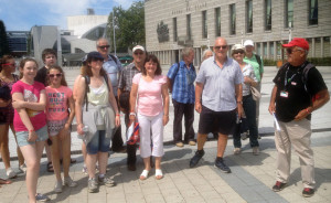 The Castleisland visitors pictured with a local guide outside the Hotel De Ville at the Lorient Celtic Festival during the latest visit this month.