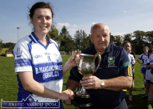 Ladies County GAA Board vice-chairman, Jerry O'Mahony presenting the intermediate championship cup  to Desmonds captain, Lorraine Scanlon after they defeated Na Gaeil in the final in Ballymacelligott on September 7th.  Lorraine will lead the team into the Munster final on Sunday. ©Photograph:  John Reidy