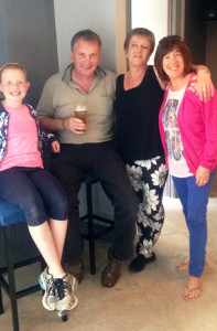 Up Scart: Betty O'Connell pictured just after she opened the doors of Kearney's Bar with her first customers and Scart natives: Michael, Bridget and Hannah Herlihy. Photograph: Melissa O'Connell.
