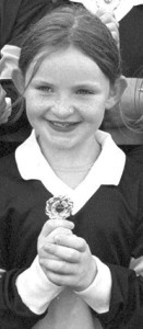 Cáit Lynch with an U-10 football medal in August 2000. She will be hoping to add a significant medal and trophy to her collection this year. 