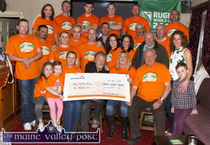 Kerry Mountain Rescue representative, Gerry Christie (seated centre) pictured receiving a cheque for €4,000 from the organisers and participants of The Longest Day Charity event. Included are, front: Maria, Abbie and Eileen Greaney, Mr. Christie, Georgina Fagan, Jerry Courtney and Conor Clifford. Second row: Tony Nolan, Mike O'Sullivan, Norma Nolan-Moran, Gerry Fagan, Denny Greaney, Ted Clifford, Noranne Scollard, Pam Carmody, Hugh O'Connor, Tim O'Sullivan, Michael O'Brien and Fiona Clifford. Back row: Maria Brosnan, Tom McCarthy, host; Cian Fagan, Kevin Moran, David Carmody and Jerry Flynn. ©Photograph: John Reidy