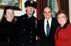 NYPD Officer, John Fleming pictured with his wife, Kate (nee McCarthy) and her mother Katie (nee Quinn) in Mayor Giuliani's office after he was promoted to Detective First-Grade.