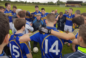 Jimmy Roche talks with the Cordal team after their victory on Sunday.
